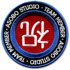 Ecusson brodé de la société de création de jeu vidéo Asobo studio. Il représente, eu centre en blanc sur un fond rouge, deux idéogrammes chinois. Autour, un bandeau bleu puis un bandeau noir sur lequel il est écrit Asobo studio Team member deux fois.